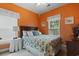 Bright bedroom features a large window, floral bedding, and a wooden headboard at 5070 Windsor Green Way # 204, Myrtle Beach, SC 29579