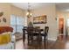 Cozy dining area features a wooden table and chairs with a view from the window at 5070 Windsor Green Way # 204, Myrtle Beach, SC 29579