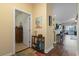 Warm and inviting hallway with decorative accents, leading to the living spaces and bedrooms at 5070 Windsor Green Way # 204, Myrtle Beach, SC 29579