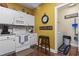 Bright kitchen features white appliances, modern countertops, and a view into the laundry room at 5070 Windsor Green Way # 204, Myrtle Beach, SC 29579