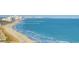 Panoramic view of a pier and the ocean, with waves gently rolling in at 5905 S Kings Hwy. # 1801-C, Myrtle Beach, SC 29575