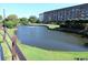 View of the pond and building with landscaping and a walking path at 5905 S Kings Hwy. # 1801-C, Myrtle Beach, SC 29575