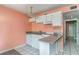 Kitchen featuring white appliances, a granite countertop, and easy access into other rooms with tile flooring at 5905 S Kings Hwy. # 235B, Myrtle Beach, SC 29575