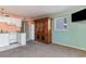 Living area with white kitchen adjacent to a dining area, and classic hutch that gives the space cozy aesthetic at 5905 S Kings Hwy. # 235B, Myrtle Beach, SC 29575