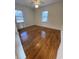 Bright bedroom featuring hardwood floors and a ceiling fan at 611 E Ashland St., Andrews, SC 29510