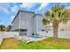 Inviting backyard featuring a private pool area, lounge seating, with a palm tree backdrop at 624-B Seabreeze Dr., Garden City Beach, SC 29576