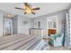 Bedroom featuring a king-size bed, dresser, and chair with en-suite bathroom at 624-B Seabreeze Dr., Garden City Beach, SC 29576