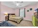 Charming bedroom with a patterned comforter, green dresser, and plenty of natural light at 624-B Seabreeze Dr., Garden City Beach, SC 29576