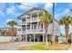 Lovely raised beach house with double balconies and ample parking space beneath at 624-B Seabreeze Dr., Garden City Beach, SC 29576