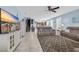 Inviting living room with a ceiling fan, neutral furniture, and stairs leading to the upper level at 624-B Seabreeze Dr., Garden City Beach, SC 29576