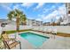 Refreshing pool area featuring a private pool with chairs and a palm tree backdrop at 624-B Seabreeze Dr., Garden City Beach, SC 29576