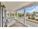 Inviting porch featuring white wicker seating, beautiful views, and complimented by white railings at 624-B Seabreeze Dr., Garden City Beach, SC 29576