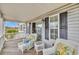 Relaxing porch featuring white wicker seating, beautiful views, and complemented by the white railing at 624-B Seabreeze Dr., Garden City Beach, SC 29576