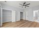 Spacious bedroom featuring wood floors and three closets for storage at 6606 Wildwood Trail # D, Myrtle Beach, SC 29572