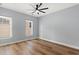 Bedroom featuring light colored walls and two windows at 6606 Wildwood Trail # D, Myrtle Beach, SC 29572