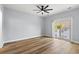 This bedroom features a ceiling fan and a sliding glass door at 6606 Wildwood Trail # D, Myrtle Beach, SC 29572