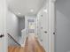 Bright hallway with wood floors, recessed lighting and white doors, creating a clean and inviting space at 6606 Wildwood Trail # D, Myrtle Beach, SC 29572