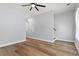 This living room features a ceiling fan, light colored walls, and wood floors at 6606 Wildwood Trail # D, Myrtle Beach, SC 29572