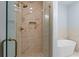 This bathroom features a glass enclosed shower and a soaking tub at 6606 Wildwood Trail # D, Myrtle Beach, SC 29572