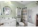 Cozy bathroom featuring a vanity sink, a bathtub with shower, and a cabinet at 677 Wilshire Ln. # 677, Murrells Inlet, SC 29576