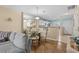 Dining area with a glass-top table and seating, plus an open view into the kitchen area at 677 Wilshire Ln. # 677, Murrells Inlet, SC 29576