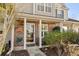 Charming front porch with decorative pillars and inviting entrance at 677 Wilshire Ln. # 677, Murrells Inlet, SC 29576