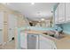 Open-concept kitchen featuring white cabinetry and a stainless steel dishwasher at 677 Wilshire Ln. # 677, Murrells Inlet, SC 29576