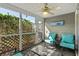 Relaxing screened in porch with comfortable seating and great natural light at 677 Wilshire Ln. # 677, Murrells Inlet, SC 29576