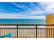 Balcony view of a serene beach with blue skies, an inviting ocean, and a calming atmosphere at 6900 N Ocean Blvd. # 1536, Myrtle Beach, SC 29572