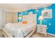 Bright bedroom with coastal decor, queen bed, and side tables with lamps at 6900 N Ocean Blvd. # 1536, Myrtle Beach, SC 29572