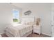 Bright bedroom featuring a decorative bird themed art and a cozy bed with neutral décor at 8058 Bear Claw Ct., Conway, SC 29526