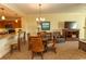 Cozy dining area with stainless steel appliances, breakfast bar and modern lighting at 8121 Amalfi Pl. # 4-702, Myrtle Beach, SC 29572