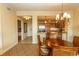 Dining area with stainless steel appliances, seamless view into the kitchen and bedroom hallway at 8121 Amalfi Pl. # 4-702, Myrtle Beach, SC 29572