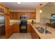 Well-equipped kitchen featuring stainless steel appliances, granite countertops, and ample wooden cabinetry at 8121 Amalfi Pl. # 4-702, Myrtle Beach, SC 29572