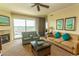 Comfortable living room with fireplace and outdoor view from the balcony at 8121 Amalfi Pl. # 4-702, Myrtle Beach, SC 29572