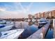 A view showcases yachts docked with buildings in the backdrop, highlighting waterfront living at 8121 Amalfi Pl. # 4-702, Myrtle Beach, SC 29572