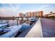 A marina showcases yachts docked with buildings in the backdrop, highlighting waterfront living at 8121 Amalfi Pl. # 4-702, Myrtle Beach, SC 29572