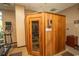 A wooden sauna room offers a place for relaxation and stress reduction after exercising at 8121 Amalfi Pl. # 4-702, Myrtle Beach, SC 29572