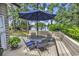 Enjoy outdoor living on this backyard deck complete with dining and a view of the lake at 8234 Timber Ridge Rd., Conway, SC 29526