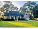 Charming single-Gathering home boasting a manicured lawn and lush landscaping, complete with an attached two-car garage at 8234 Timber Ridge Rd., Conway, SC 29526