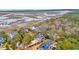 Stunning aerial view showcasing the home's waterfront location and lush surroundings at 830 Channel Cat Cove, Murrells Inlet, SC 29576