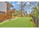 Backyard featuring a putting green, fenced perimeter, and complemented by a staircase leading to an upper deck at 830 Channel Cat Cove, Murrells Inlet, SC 29576