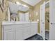 Bathroom vanity with double sinks, large mirror and dark tile flooring at 830 Channel Cat Cove, Murrells Inlet, SC 29576