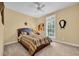 Cozy bedroom with a ceiling fan and a large window at 830 Channel Cat Cove, Murrells Inlet, SC 29576