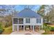 Charming elevated home featuring a metal roof, screened porch, and stilt construction at 830 Channel Cat Cove, Murrells Inlet, SC 29576