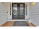 Welcoming entryway featuring a double front door, wood flooring, and a stylish exterior at 830 Channel Cat Cove, Murrells Inlet, SC 29576