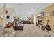 Spacious living room with high ceilings, a fireplace, and ample natural light at 830 Channel Cat Cove, Murrells Inlet, SC 29576