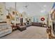 Expansive living room with vaulted ceiling, fireplace, and comfortable seating at 830 Channel Cat Cove, Murrells Inlet, SC 29576