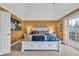 Serene main bedroom with neutral tones, tray ceilings, and access to a private balcony at 830 Channel Cat Cove, Murrells Inlet, SC 29576