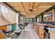 Covered outdoor living area with nautical decor and a wooden bar at 830 Channel Cat Cove, Murrells Inlet, SC 29576